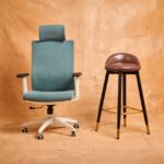 A teal adjustable office chair and a tall brown stool side by side, illustrating seating options relevant to choosing adjustable foot stools for seniors