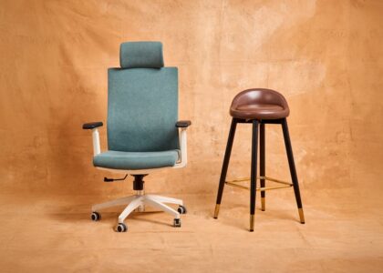 A teal adjustable office chair and a tall brown stool side by side, illustrating seating options relevant to choosing adjustable foot stools for seniors