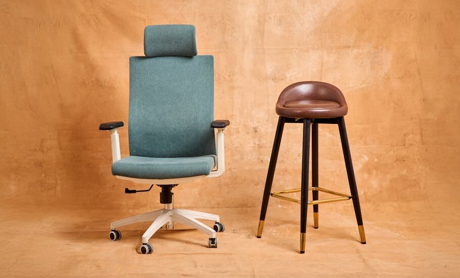 A teal adjustable office chair and a tall brown stool side by side, illustrating seating options relevant to choosing adjustable foot stools for seniors