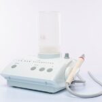 best dental irrigators — High-quality dental suction device on a white background, ideal for dental care contexts.