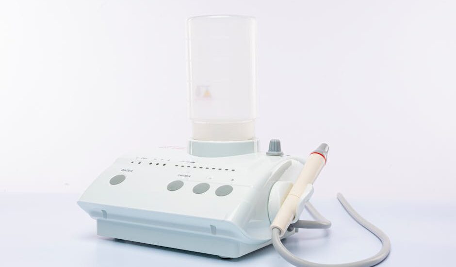 best dental irrigators — High-quality dental suction device on a white background, ideal for dental care contexts.