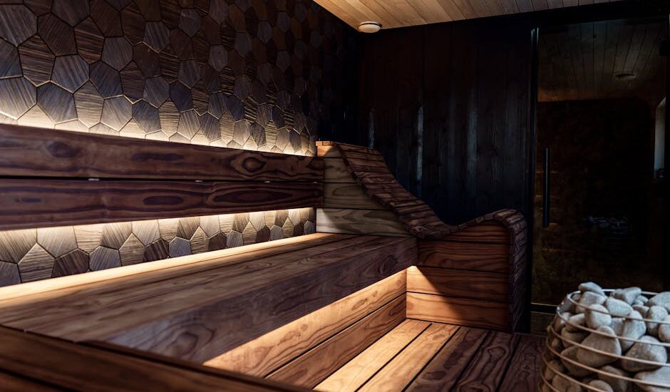 Contemporary wooden infrared sauna with geometric wall panels and soft lighting, illustrating top home sauna options for 2026
