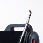 Close-up of a dental laser machine with a screen and handpiece, showcasing modern medical technology.