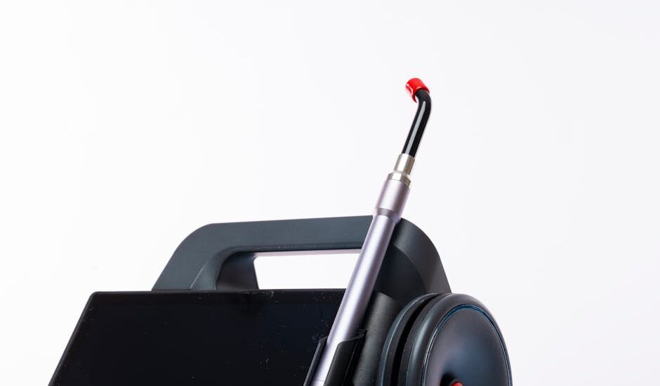 Close-up of a dental laser machine with a screen and handpiece, showcasing modern medical technology.