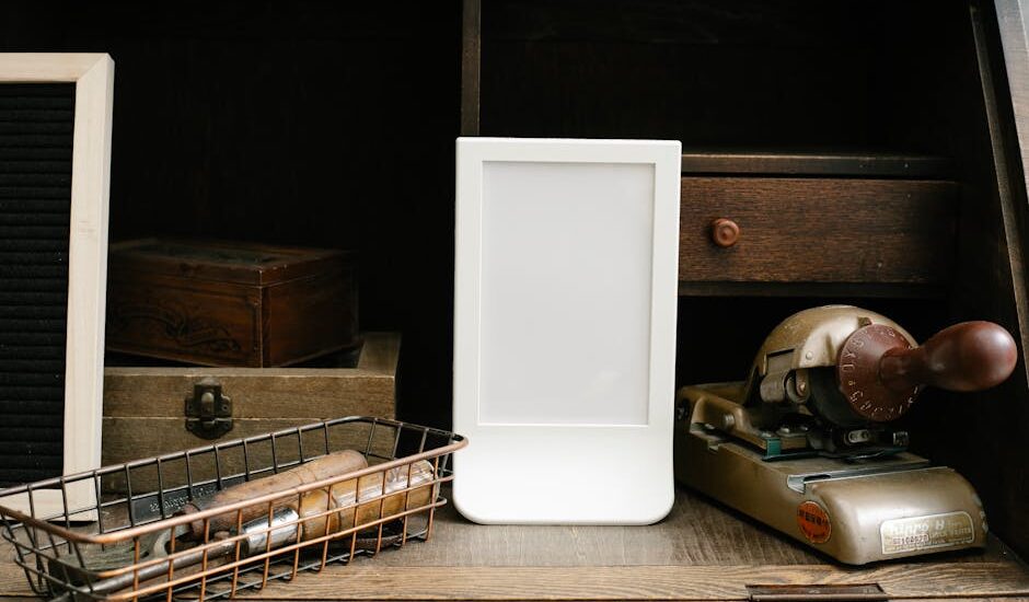 A white light therapy lamp sits on a wooden desk among vintage office items, illustrating options for dementia care lighting.