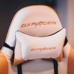Close-up of a DXRacer gaming chair featuring a padded lumbar support cushion, illustrating lumbar support options for best cushions in 2026.
