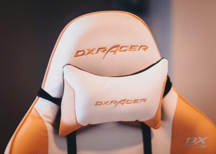 Close-up of a DXRacer gaming chair featuring a padded lumbar support cushion, illustrating lumbar support options for best cushions in 2026.