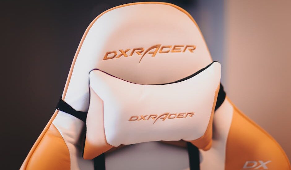 Close-up of a DXRacer gaming chair featuring a padded lumbar support cushion, illustrating lumbar support options for best cushions in 2026.