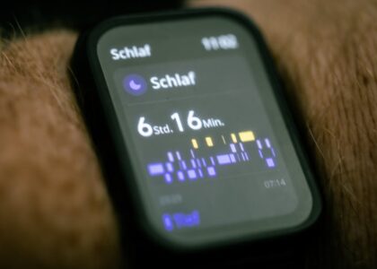 Close-up of a wearable sleep tracking device on a wrist, showing detailed sleep data, for kids’ sleep monitor guide.