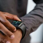 A detailed view of a smartwatch tracking fitness on a person's wrist.