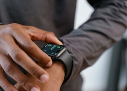 A detailed view of a smartwatch tracking fitness on a person's wrist.