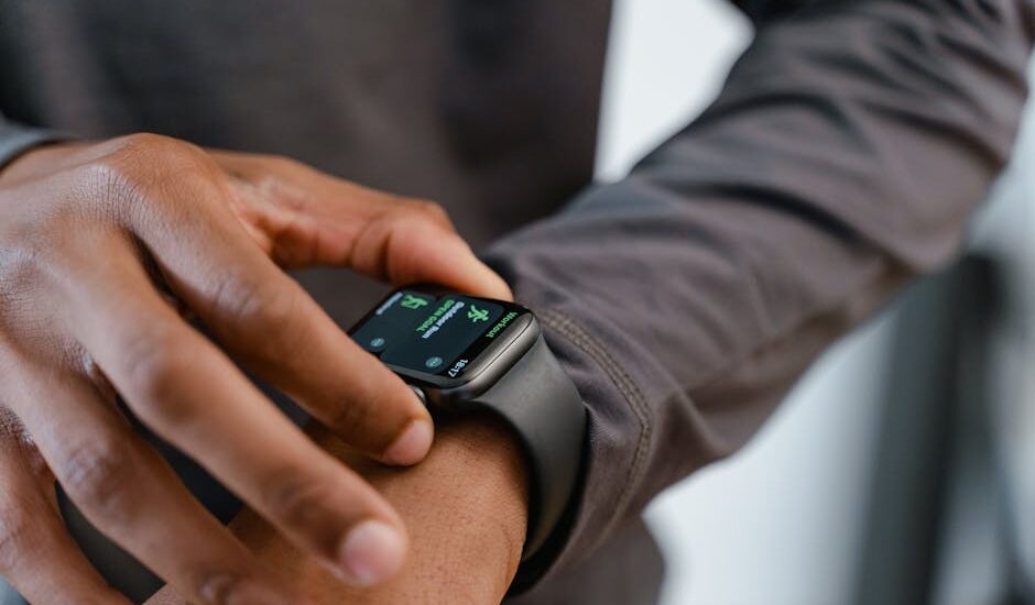 A detailed view of a smartwatch tracking fitness on a person's wrist.