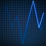 ECG graph on a grid background symbolizing heartbeat and medical data.