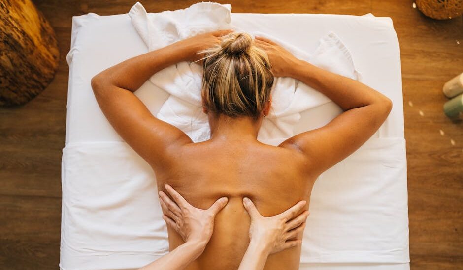 Experience ultimate relaxation with a therapeutic back massage at a serene spa setting.
