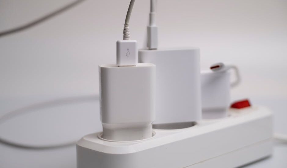 how to charge electric heating pad — Minimalist composition of electronic device chargers connected to a power strip indoors.