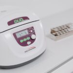Medical device with digital display on a white counter, illustrating equipment setup for a CPAP machine guide article