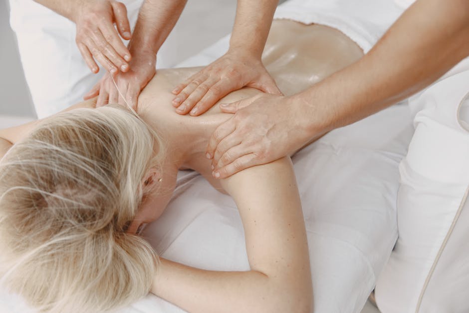 Woman receiving a relaxing back massage promoting wellness and stress relief.