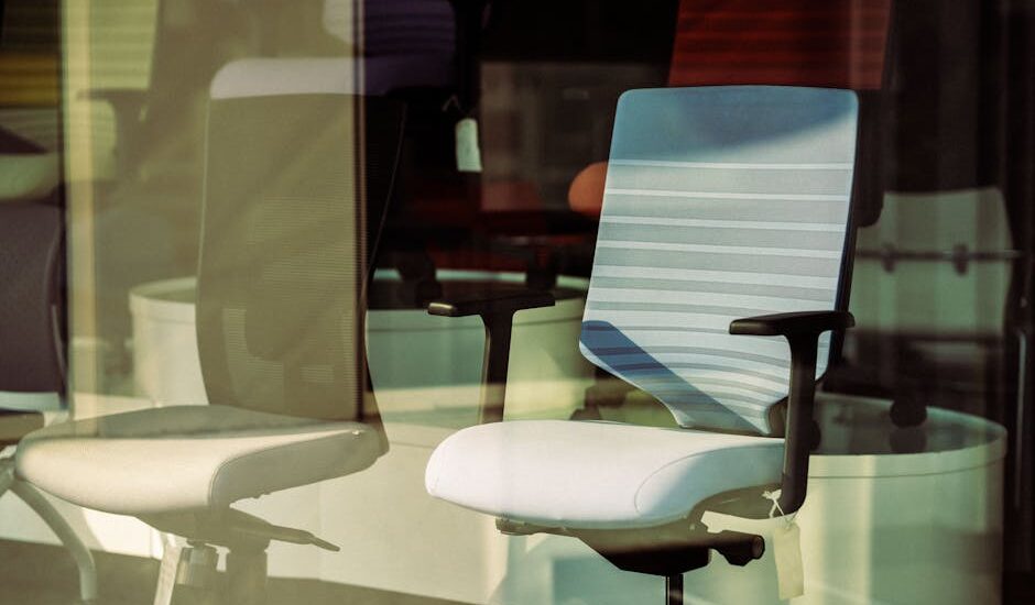 Two ergonomic office chairs with supportive seat cushions, illustrating options for posture corrector seat cushions in a store display.