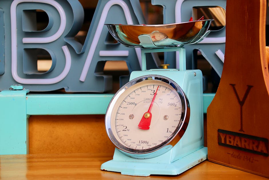 Close-up of a vintage blue kitchen scale with fruits in a modern setting.