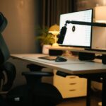 A cozy home office featuring an ergonomic chair, computer setup, and ambient lighting for a productive environment.