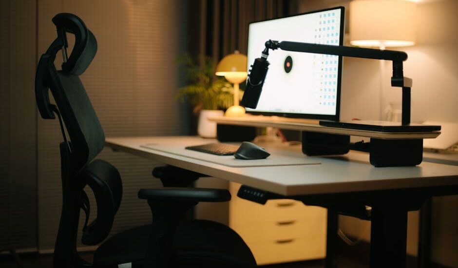 A cozy home office featuring an ergonomic chair, computer setup, and ambient lighting for a productive environment.