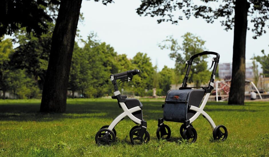 Two adjustable rollator walkers with seats on grass, illustrating mobility aids.