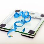 A digital scale with a measuring tape, illustrating the comparison of digital and analog scales.