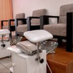 Electric foot baths for sale shown in a spa with chairs and basins.