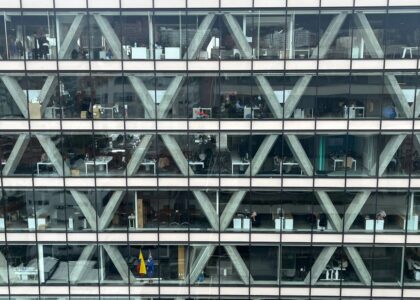 A view of an office building showcasing multiple workstations, relevant to heated lumbar support pillows.