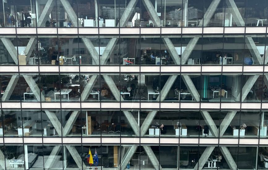 A view of an office building showcasing multiple workstations, relevant to heated lumbar support pillows.