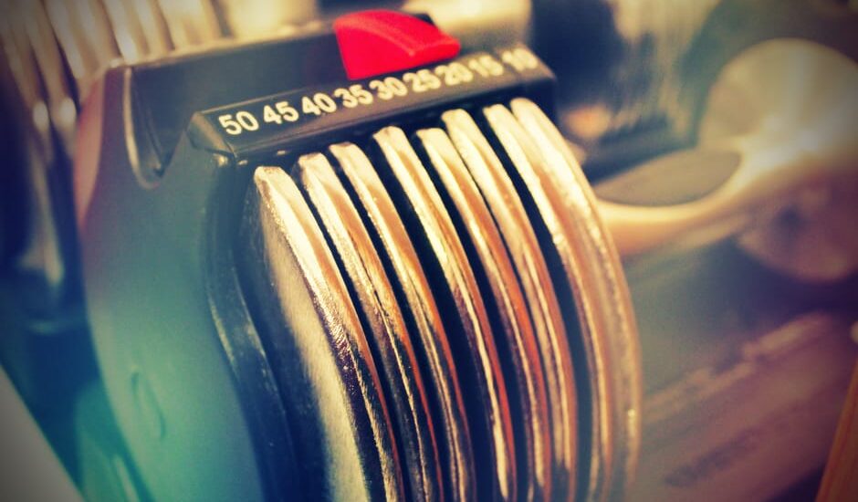 Image showing the weight adjustment mechanism of adjustable dumbbells, relevant to assembling them.