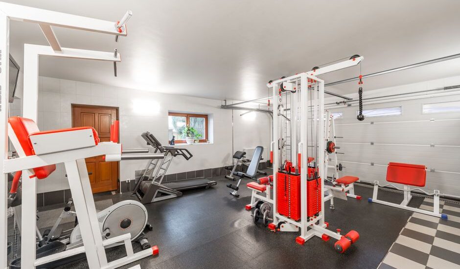 A home gym featuring a treadmill and various fitness equipment, relevant for replacing a treadmill belt.