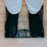 A person standing on a smart scale, relevant to the accuracy of smart scales.