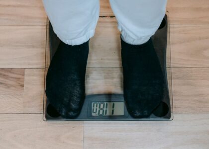 A person standing on a smart scale, relevant to the accuracy of smart scales.