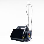 A portable suction unit designed for EMS, featuring a display and suction tubing.