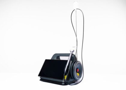 A portable suction unit designed for EMS, featuring a display and suction tubing.