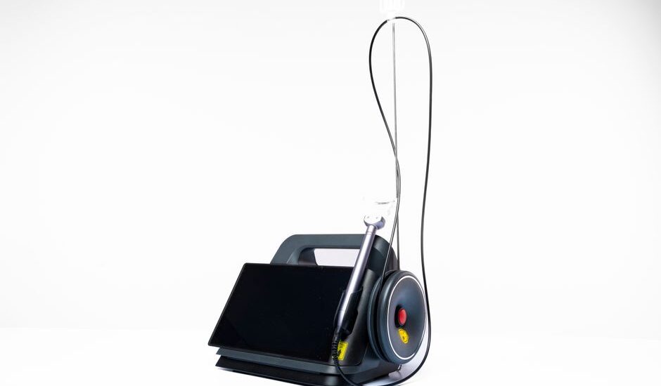 A portable suction unit designed for EMS, featuring a display and suction tubing.