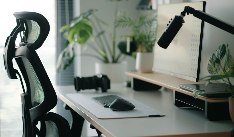 A smart sensing chair positioned at a desk, illustrating posture detection technology.