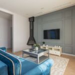 A modern living room featuring a TV, suitable for wireless hearing aids use.