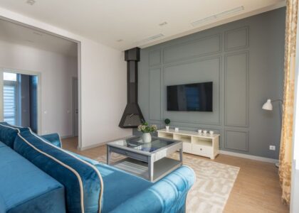 A modern living room featuring a TV, suitable for wireless hearing aids use.