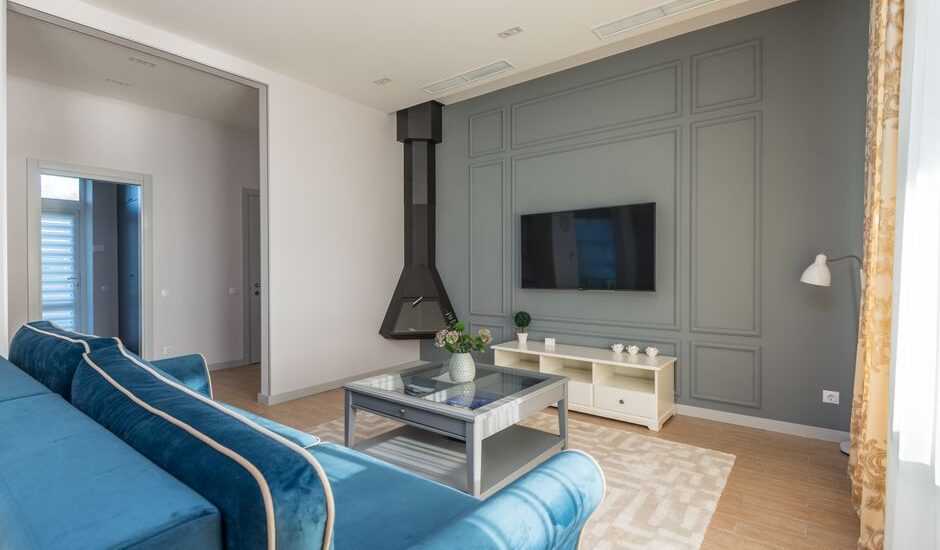 A modern living room featuring a TV, suitable for wireless hearing aids use.