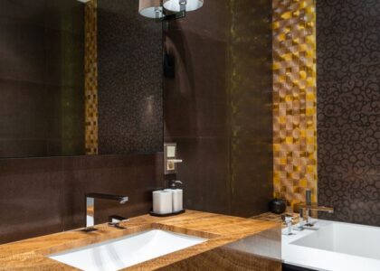 A stylish bathroom with a countertop and a visible automatic toothpaste dispenser.