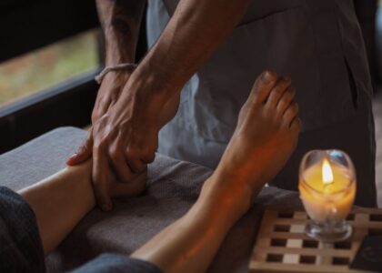 A person receiving a foot massage, illustrating techniques to boost foot circulation.