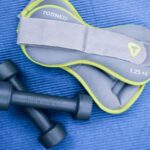 A weighted vest and dumbbell weights, illustrating options for resistance training.