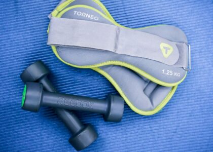 A weighted vest and dumbbell weights, illustrating options for resistance training.