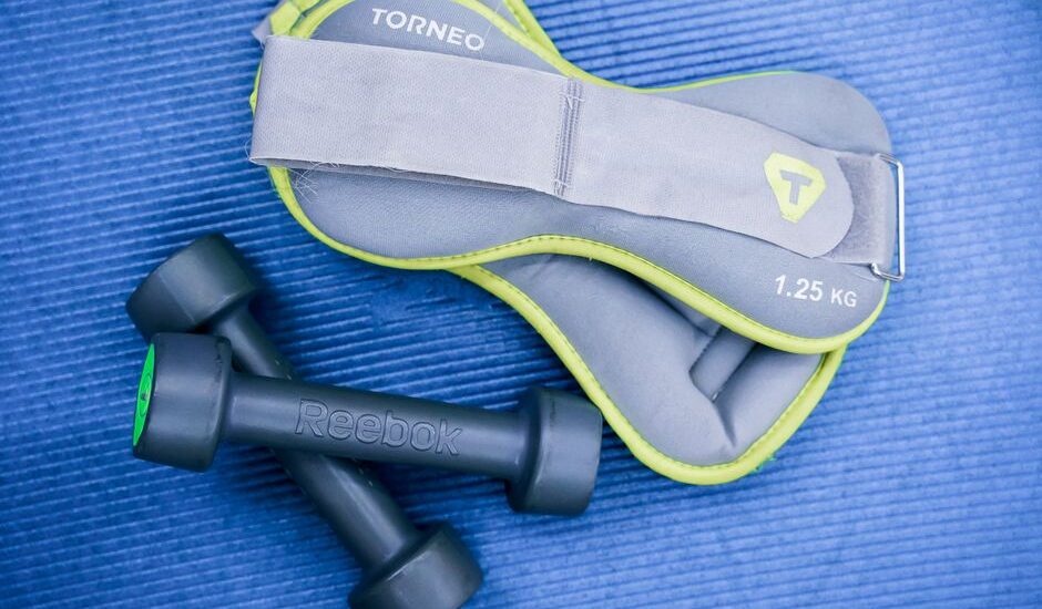 A weighted vest and dumbbell weights, illustrating options for resistance training.